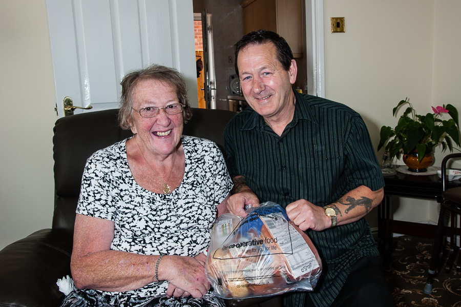 Housebound pensioner Joan Porrett has her shopping delivered to her home every week. Home delivery driver Barry Scully is pictured with her.