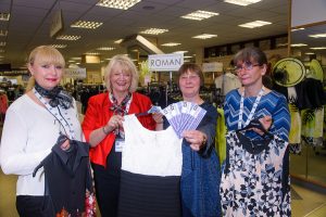 Tamworth Co-op prize draw winner Sue Cockeram receives her vouchers from floor controller Julie Plummer. Also helping her choose the right outfit for her sister’s wedding are sales advisers Amanda Powell and Tracy Bowman.