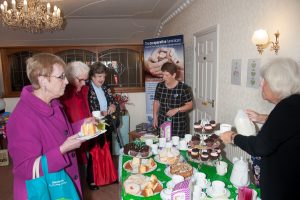 Coffee is served….residents enjoying refreshments at Macmillan fundraiser.