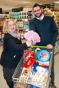 Competition winner Joanne Siviter receives her £200 prize from Tamworth Co-op area manager Phil Drury. The money will go towards some Christmas treats for her family.