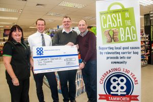 Dan Welsh, general manager of Tamworth Co-op food division, hands over cheque for £5,000 to Steve Hodgetts and Lee Bates of Community Together, with Tamworth Co-op supermarket manager  Julie Clark.