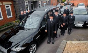 Tamworth Co-op funeral staff pictured with new funeral fleet at division's headquarters in Upper Gungate.