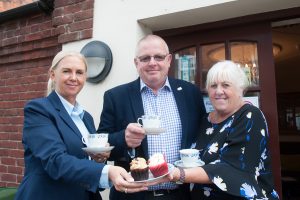 Woodville Co-op funeral director Lorraine Walker (left) and funeral arranger Sandra Wyatt will be serving up array of tasty treats for World’s Biggest Coffee Morning. Pictured with them is funeral celebrant Chris Knight who is helping to organise event.