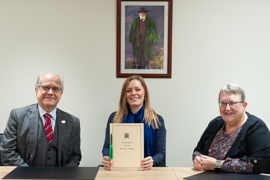 Tamworth MP Sarah Edwards pictured with a copy of her maiden speech, flanked by Julian Coles, chief executive of Tamworth Co-operative Society, and Sheree Peaple, chair of the board of directors. The presentation took part in the boardroom where a portrait of William MacGregor, the Society’s founder, hangs proudly on the wall. 